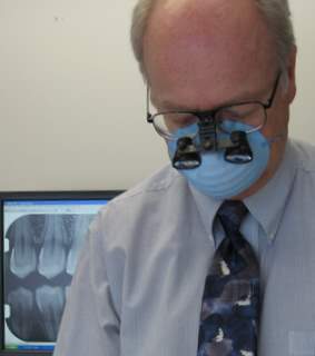 image of doctor davison with magnifying glasses