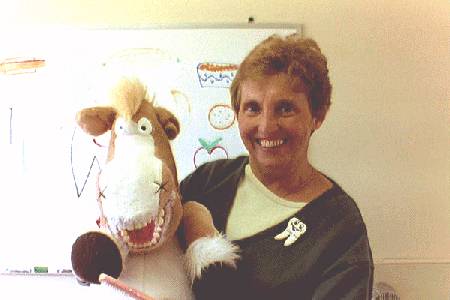 image of employee holding a puppet